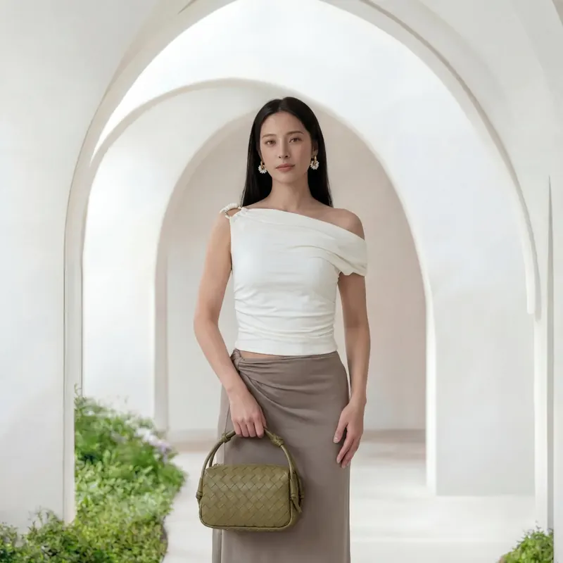 ai fashion photography by AI Studio — draped white taupe