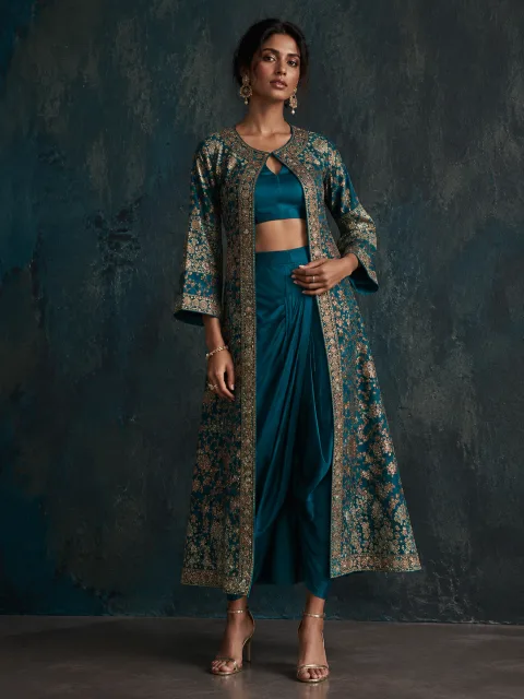 AI model in a teal and gold indo-western fusion outfit