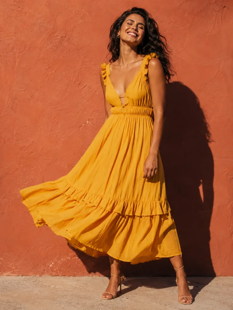 AI fashion model in a marigold summer dress against a terracotta wall